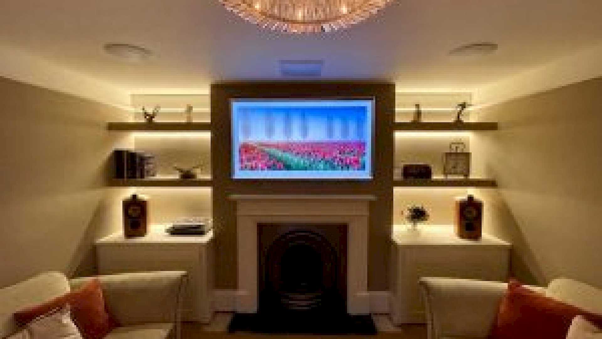 Picture Frame TV above Fireplace in Media Room