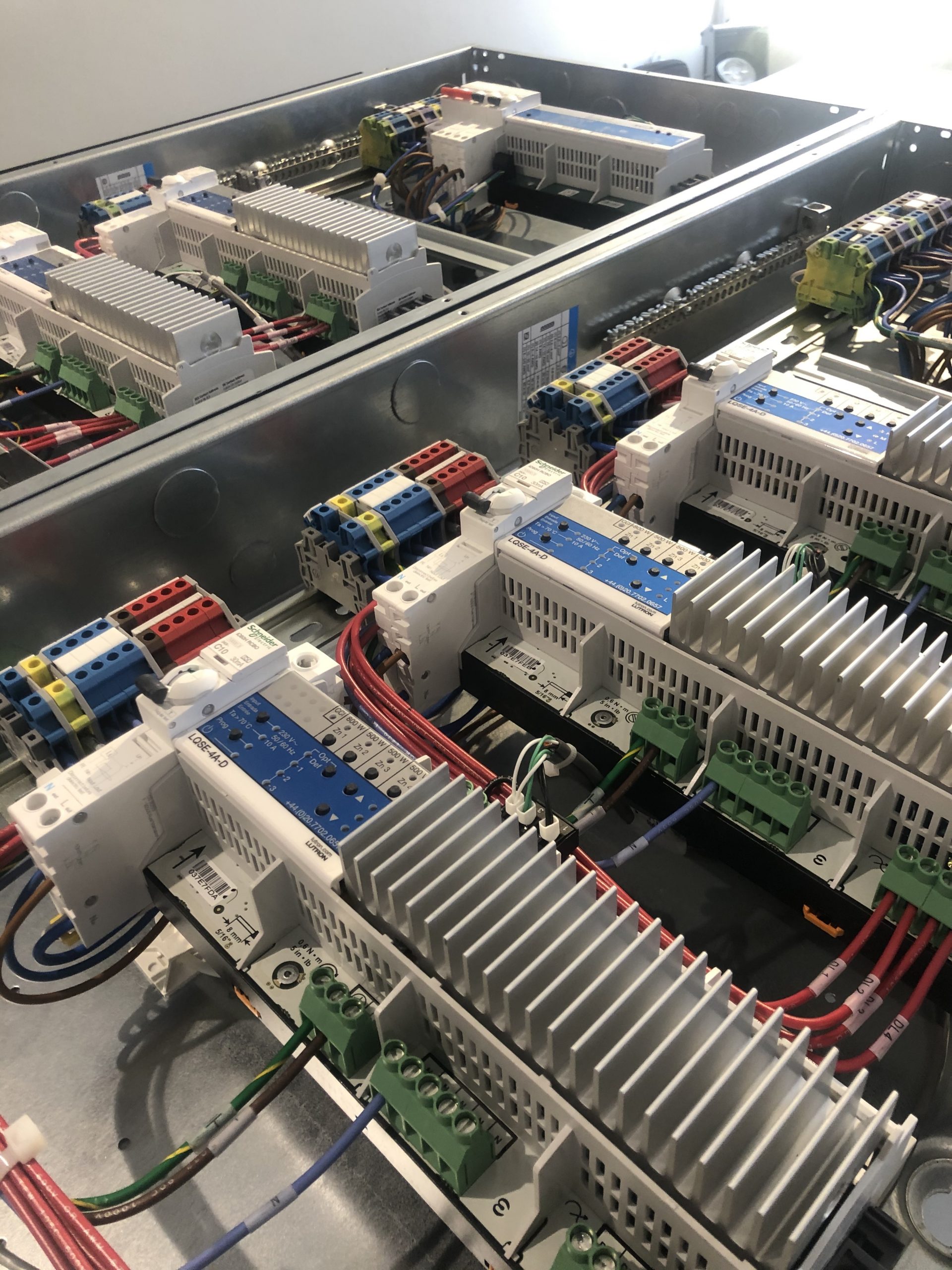 Two Lutron lighting panels with modules and processor