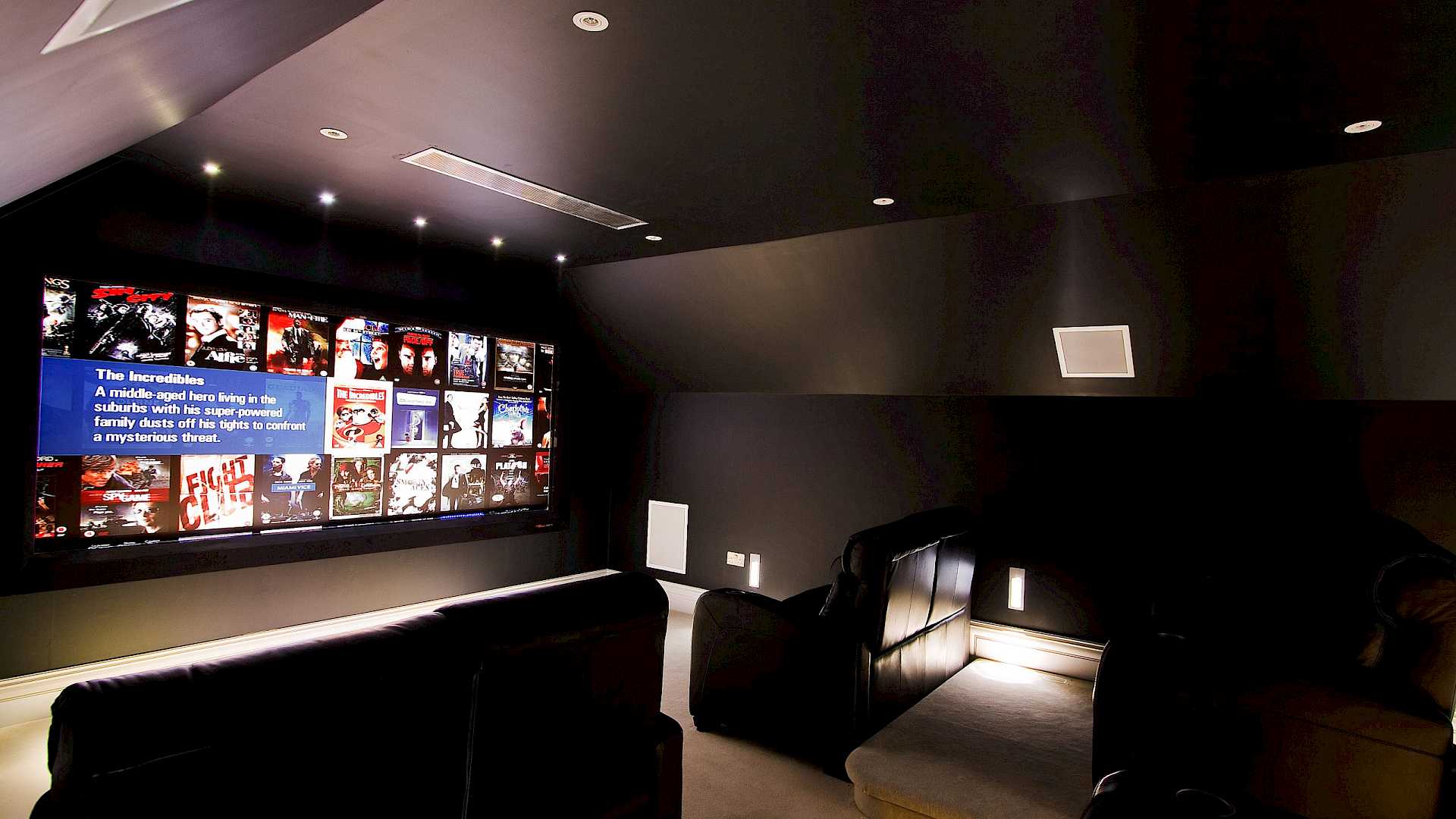 Home cinema with kaleidescape movie server, black leather home cinema seats and inwall speakers