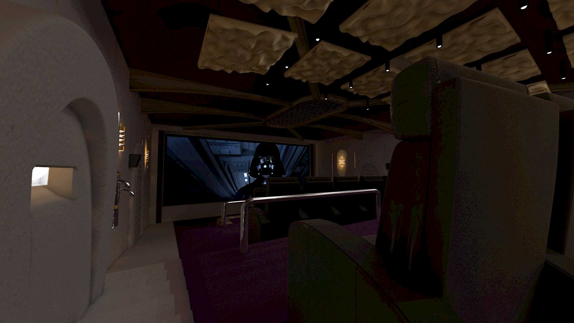 Lighting dimmed for movie, view from side left towards screen.