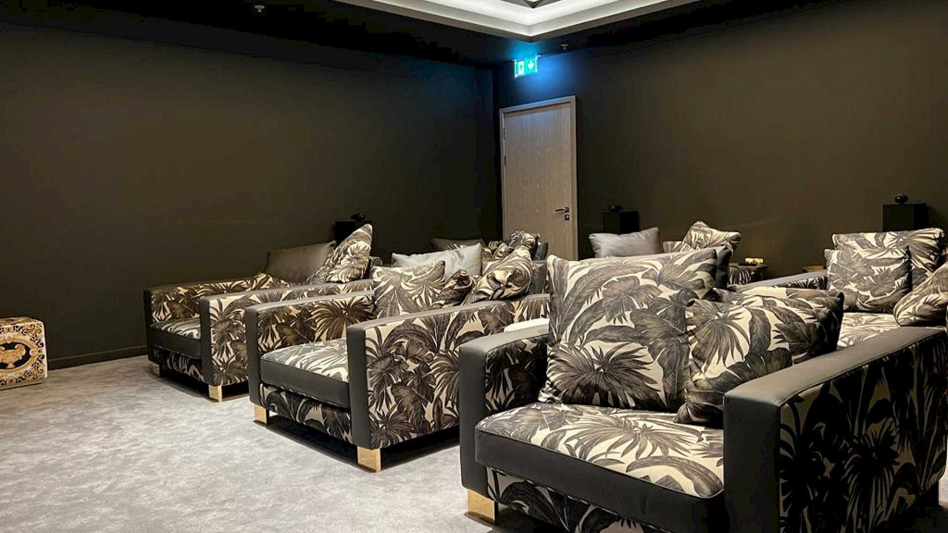 Seating in MDU communal cinema room.
