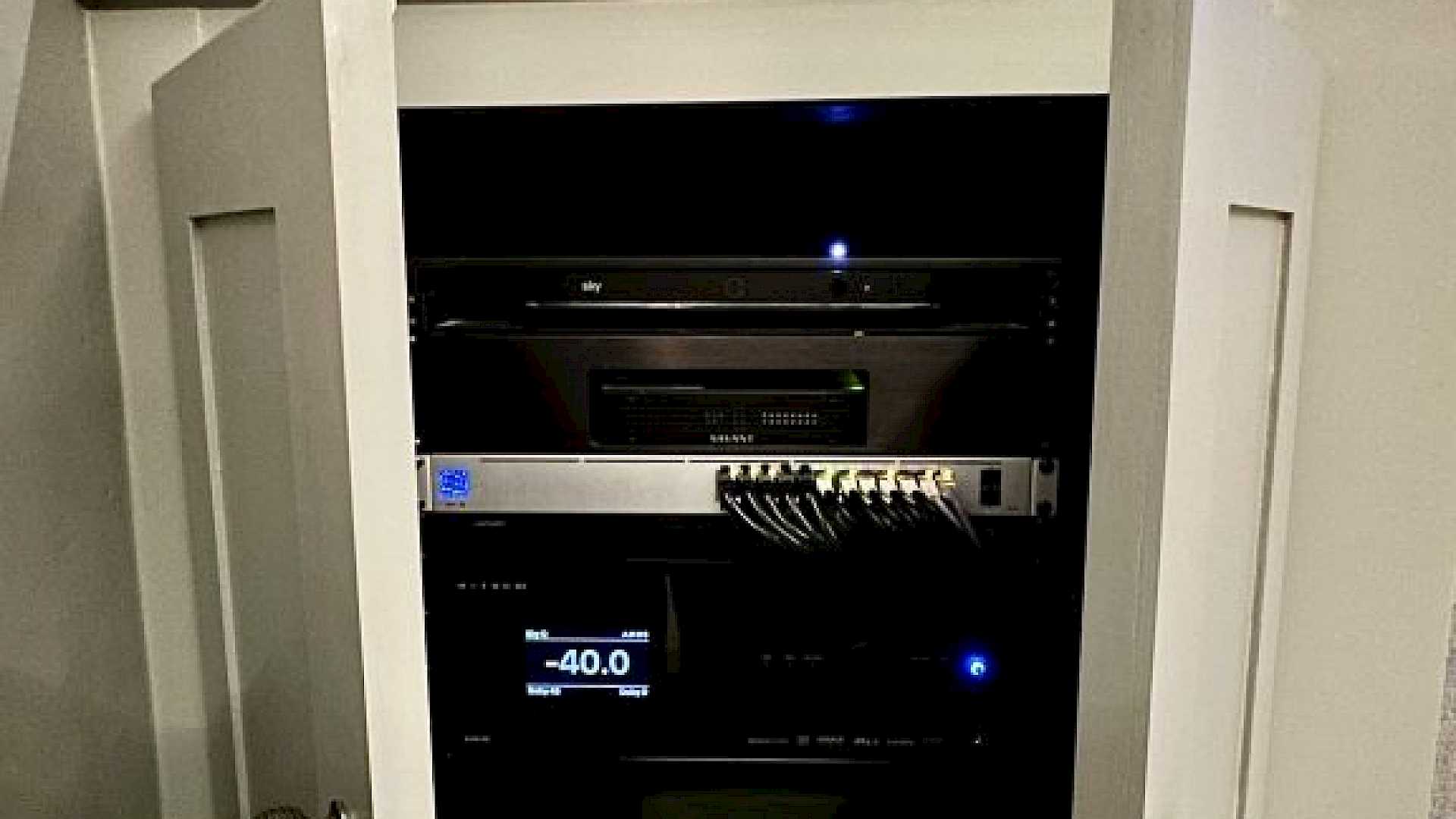 Equipment rack in small home cinema cupboard.