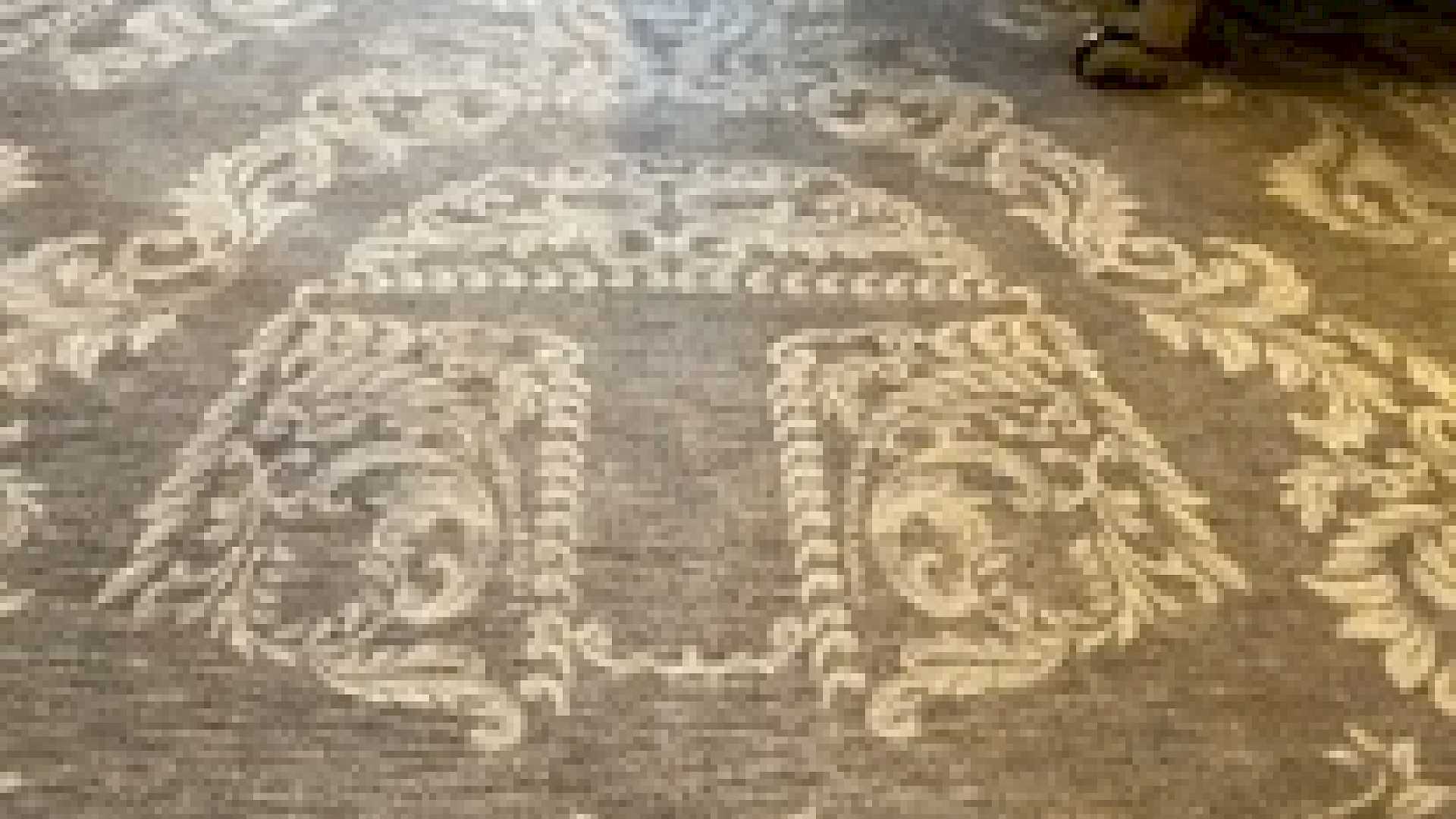 Even the rug in this small home cinema is a nod to the clients film collection.