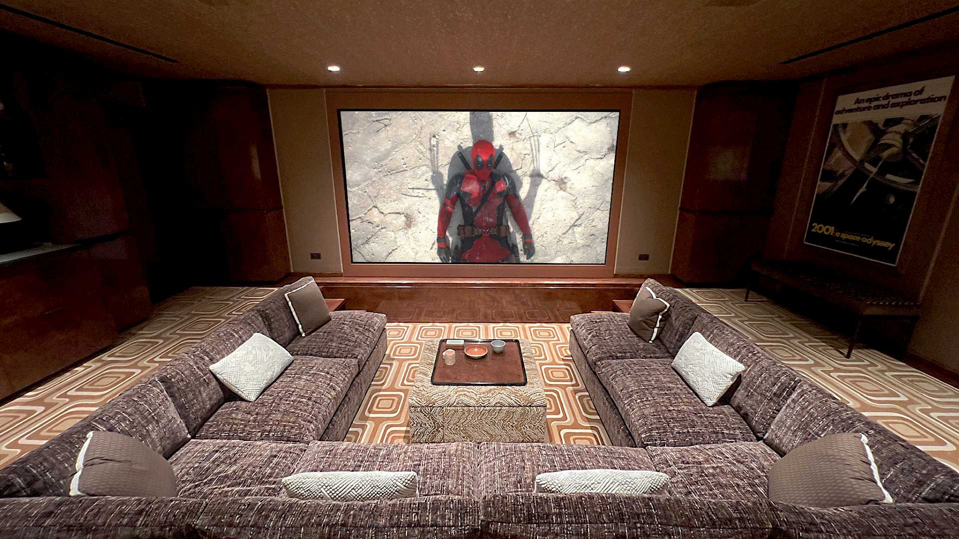 Sunken seating in this cinema. Shows seats and screen.