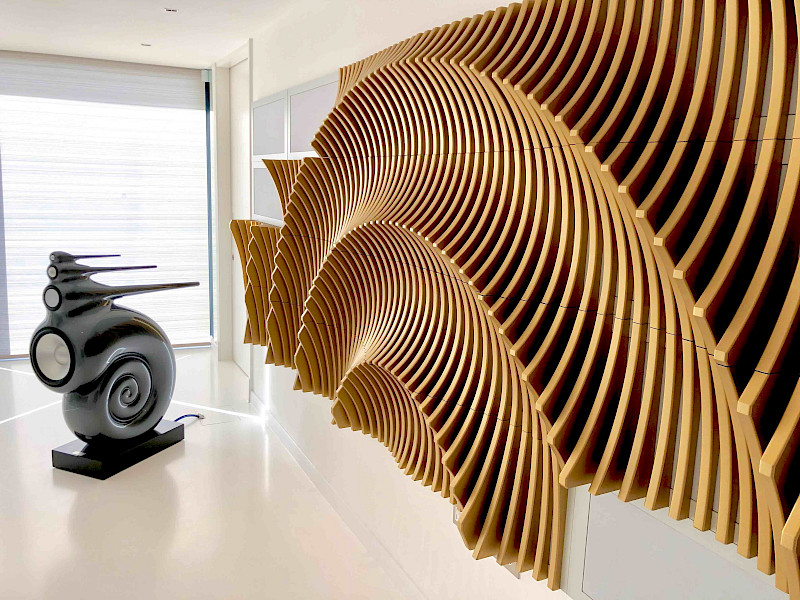 High performance listening room in Kent, with Bowers and Wilkins speakers and acoustic treatment in the style of an ammonite.
