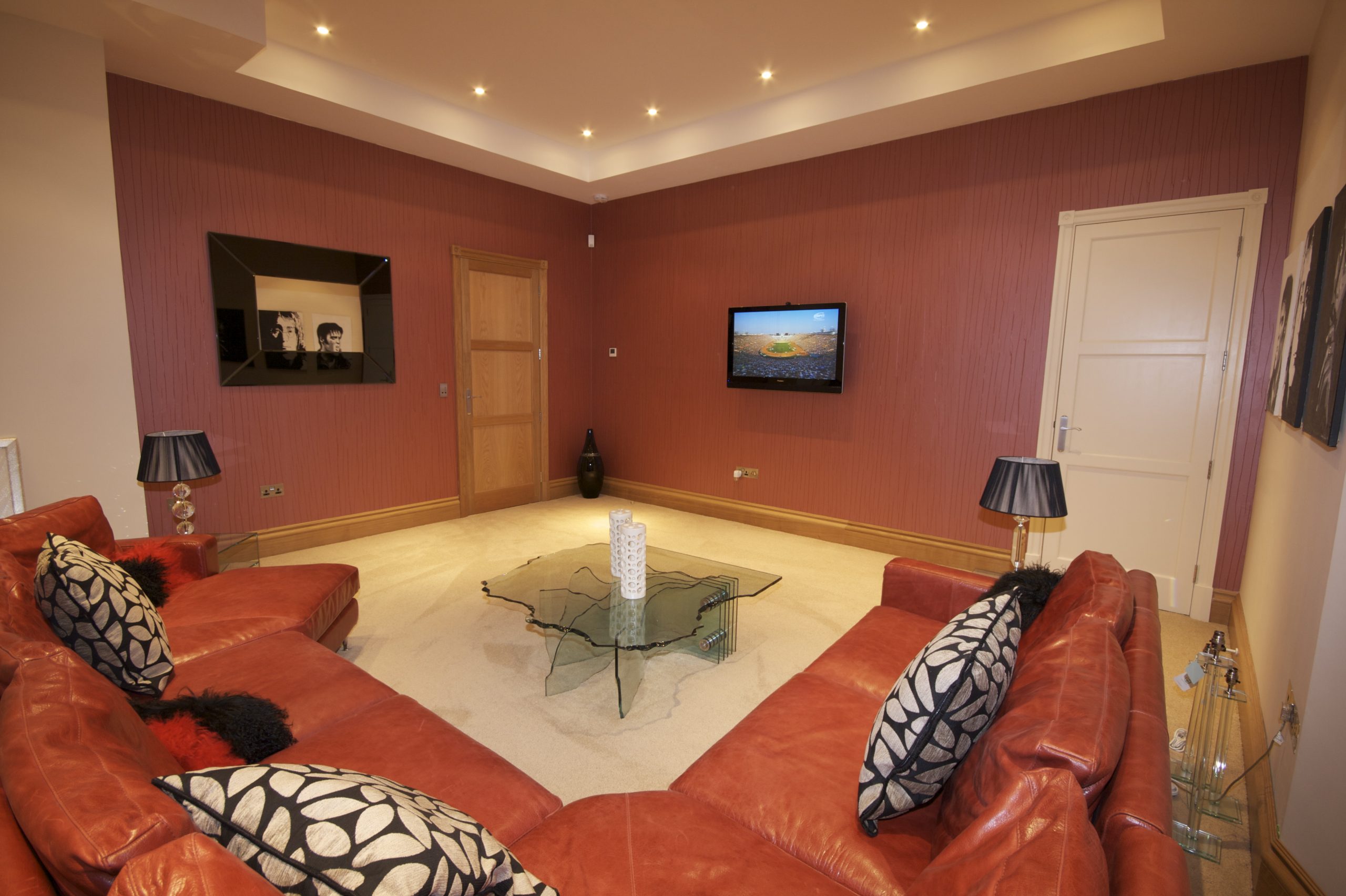 Family room with invisible speakers, part of a whole home technology solution.
