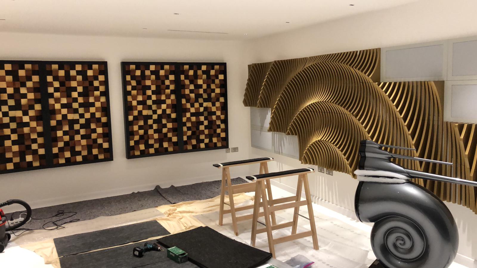 Installation of acoustic treatment in audio room.