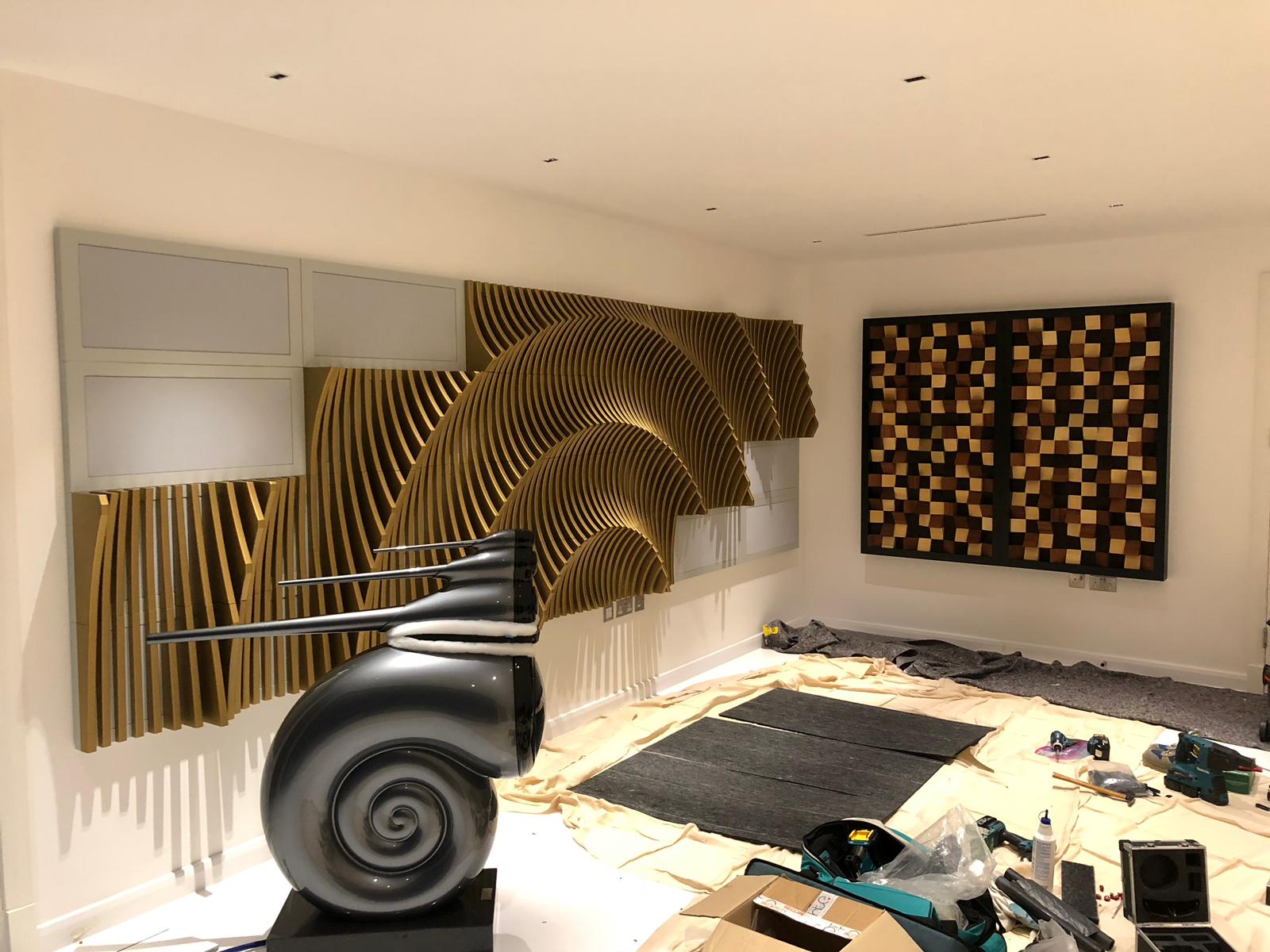 Shows installation of acoustic room treatment in ammonite room, with B&W Nautillus speaker.