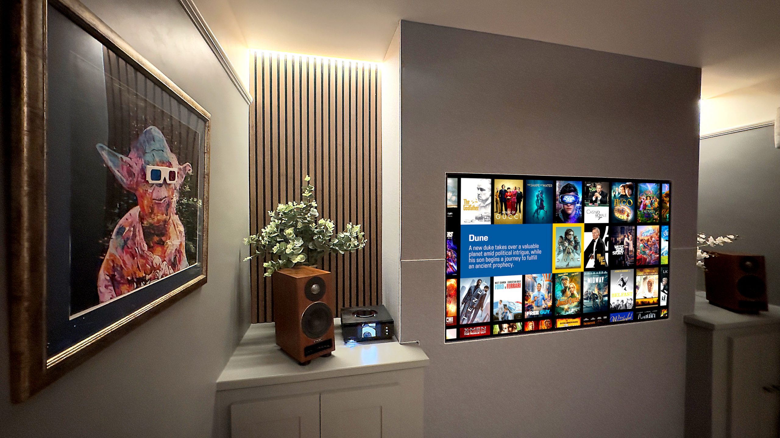 This small home cinema room provides immersive sound, in a small room. Image shows screen, acoustic panels and PMC speakers.